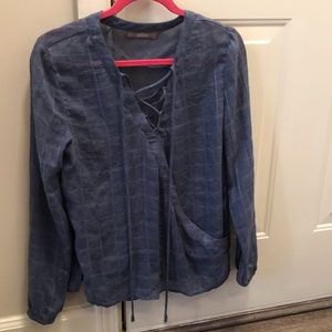 Small front tie long sleeve top. Hardly worn.
